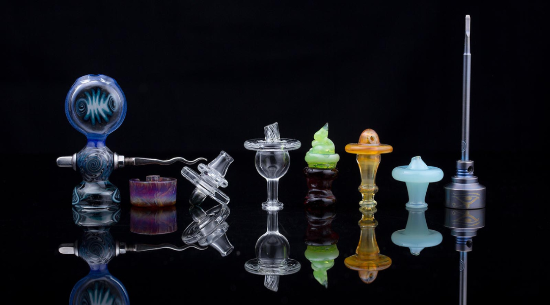 Glass carb caps of different shapes in a row